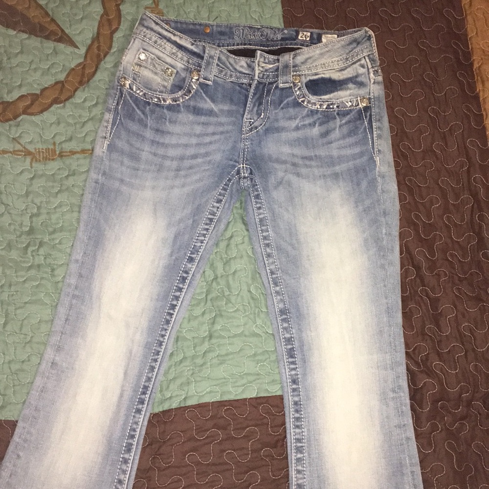 Light wash Miss Me Jeans.